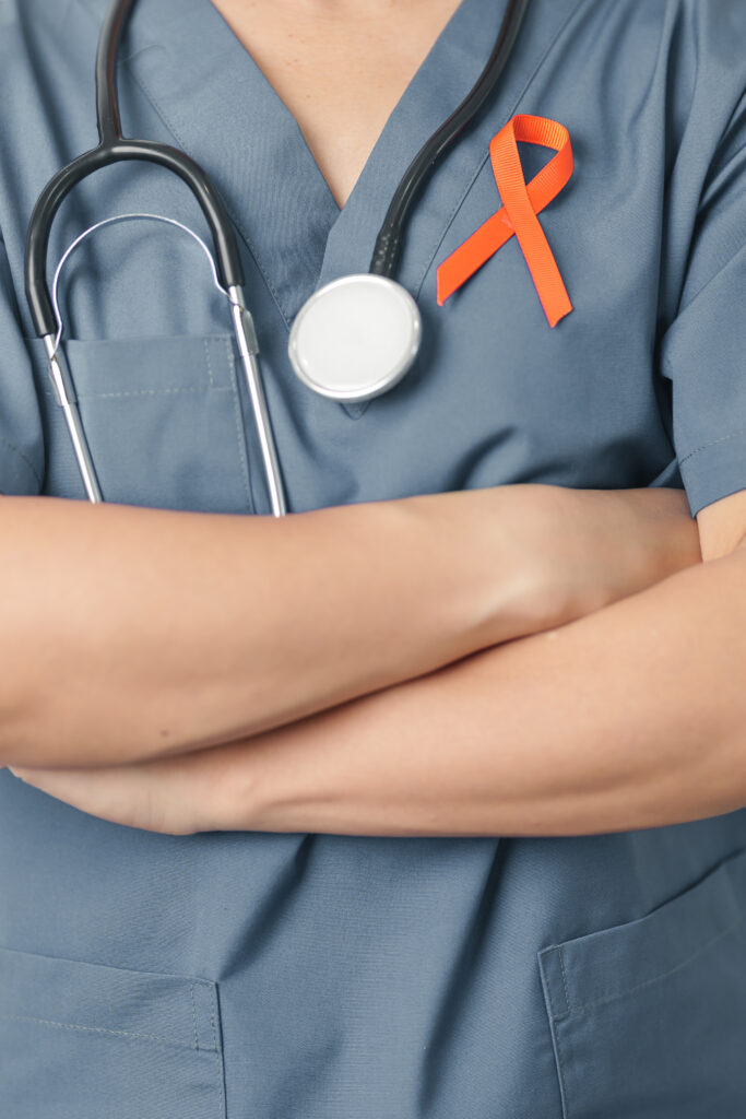 doctor wearing orange ribbon for MS awareness